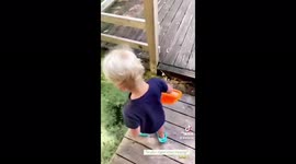 Oh no! Toddler mistakes water for grass and steps off decking into swamp