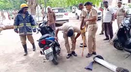 A bike was dismantled to remove the snake that was hiding inside it, in South India