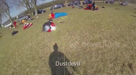 Paraglider dustdevil fail - kite blown into trees