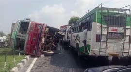 Locals scoop up spilled cooking oil after tanker overturns in central India
