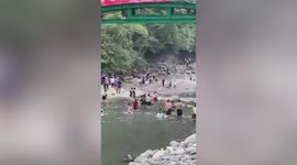 Dozens of tourists fight on riverbank in Taiwan