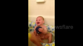 Baby Laughs in Bath