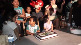 Boy Pushes Cake Off Table