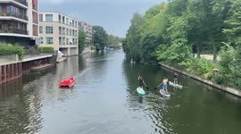 People on the canal during heat warning in Hamburg, Germany