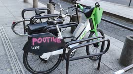 Ukraine-Russia war: graffiti reading Poutine tagged on an electric shareable Uber Lime bike. Paris, Tolbiac. 7 aug 2022