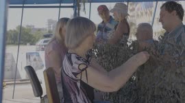 In the central square of Kharkiv, people weave camouflage nets for the Ukrainian army
