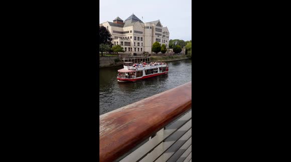 city of York watching the boats sail down the river  a great view of the fun of york times