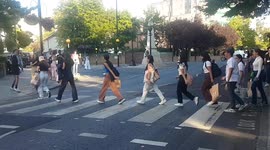 A Beatles fan somersaults on famous zebra crossing on anniversary iconic Abbey Road album cover was created