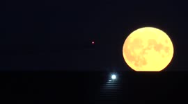 Impressive supermoon rises over London's Greenwich Penisular