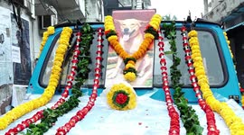 Longer version; Pet dog given sensational funeral, paraded through Indian town