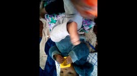 A 10 month old baby mastering soccer skills