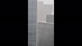 Watch as skyscrapers of downtown Denver get hit by torrential waves of rain