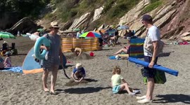 UK heatwave: Holidaymakers cool off in sea as drought declared in Cornwall