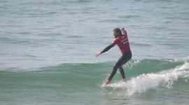Nicolas Andrade and Yolande Hopkins win BF Goodrich Longboard pro titles for Men and for Women at the Boardmasters Surfing championships Fistral Beach UK.