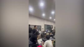 Sudden storm smashes open doors of warehouse in Thailand (second angle)