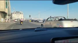 Car driving on Brighton Seafront with a Sex toy stuck on the Window