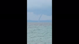 Greek bathers catch huge waterspout on camera