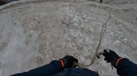 Climber navigates narrow snow bridge above 3000m crevasse in the French Alps