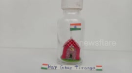 Miniature artist creates national flag inside bottle on 75th Independence Day in eastern India