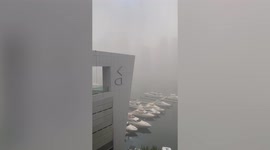 Dust storm engulfs skyscrapers causing flight cancellations in Dubai