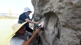 Low water levels see 600-year-old statues emerge from river in China