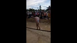 The challenge of crossing the swamp on a slippery tree