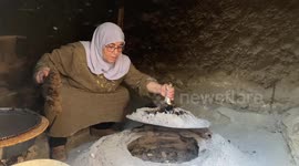 Palestinian woman Fatima Hammad, 57 prepares the traditional bread 