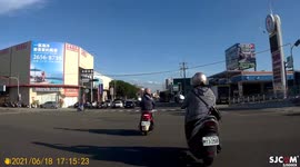 Close call: speeding moped rider almost crashes into vehicle that is turning into gas station (Dashcam Video)