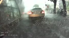 Close call: torrential downpours causing flooded streets and limited vision (Dashcam Video)