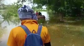 Officials rescue woman, infant stuck in flooded house in eastern India