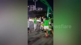 Group remove basketball stand from court so they have room to dance