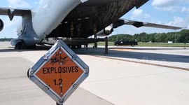 U.S. airmen load pallets of explosives onto plane bound for Ukraine
