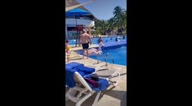 Friend jumps in the pool whilst the other friend moves the float and he bellyflops!