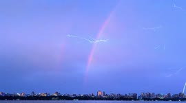 Lightning streaks across sky as double rainbows appear in China
