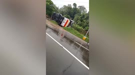 Bus topples over amid tropical storm Ma On in the Philippines