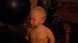 Child Wipes Boogers With Towel