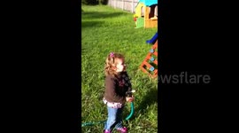 Boy Squirts Mom With Hose