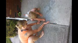 Boy Catches Grasshopper