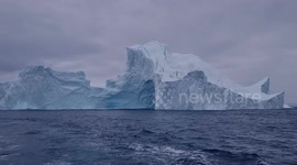 TIP OF THE ICEBERG! PHOTOGRAPHER ON TRIP TO SEE THE CHANGING LANDSCAPE OF THE ICE CAPTURES MOMENT A GIANT ICEBERG COLLAPSES INTO THE SEA