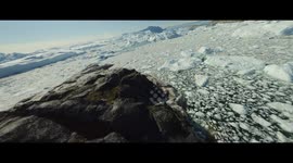 TIP OF THE ICEBERG! PHOTOGRAPHER ON TRIP TO SEE THE CHANGING LANDSCAPE OF THE ICE CAPTURES MOMENT A GIANT ICEBERG COLLAPSES INTO THE SEA