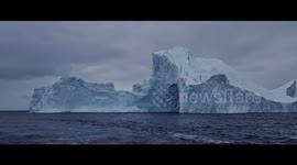 Photographer captures moment large iceberg collapses into sea in Greenland