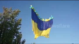 Large Ukrainian flag let loose into sky as country celebrates Independence Day