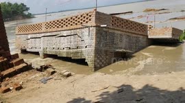 Ganges river erosion: abandoned home crashes into the river after relentless flood