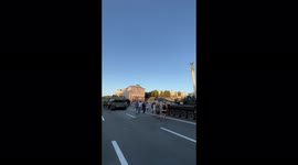 Despite 6 months of war and a siren going off, the people of Kyiv walk along