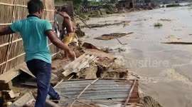 Ganges river erosion: locals attempting to protect their village from flood in Malda, India