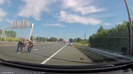 Heroic Dutch policemen risk lives to rescue man running across highway