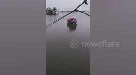 Overloaded boat carries children to school amid storm Ma-On floods