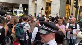 Protesters block the traffic outside Ofgem
