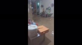 Residents try to collect their belongings as floodwaters flood their homes in Vietnam