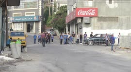 Palestinian students walk to their schools of the first day of the new year study, in al-Lubban al-Sharqiya village